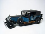 a model of an old car on a white surface
