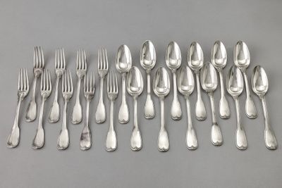 a lot of silver spoons and forks on the table