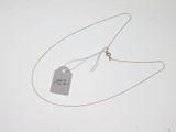 a necklace with a price tag attached to it