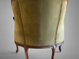an image of a chair with a green upholstered back and wood legs