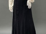 a white blouse and black skirt with ruffles on a mannequin mannequin mannequin mannequin mannequin mannequin manne