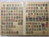 a book with stamps on the pages and a picture of people on the pages