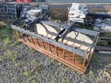 a picture of a large metal bucket with some rocks in it