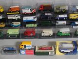 a lot of toy trucks that are on the table