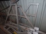 a pile of metal frames sitting on the ground