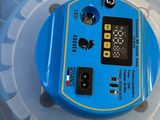 a plastic container with a blue electronic device inside of it