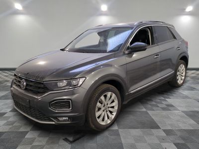 a gray volkswagen suv parked in a room with a checkered floor