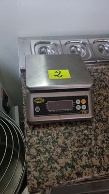 an image of a kitchen counter with a scale on it