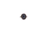 a close up of a ring on a white surface with a white background