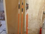 two poles that are standing in the corner of a room
