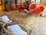 many chairs and tables in a room with a table and chairs