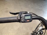 a close up of a bicycle handlebar with a gps device on it