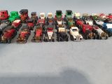 a lot of toy trucks that are lined up together