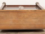 an image of a wooden bed with a glass top