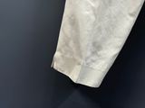 a piece of paper hanging on a hook on the wall