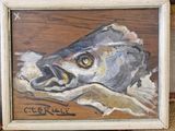 un tableau représentant un poisson posé sur une table