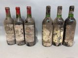 six bottles of wine are lined up in a row