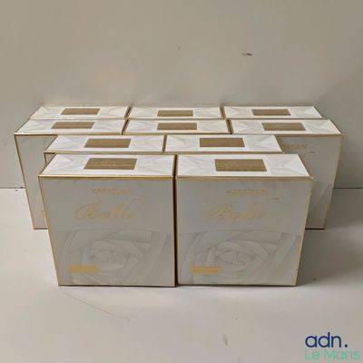 six boxes of white toilet paper sitting on top of a white table