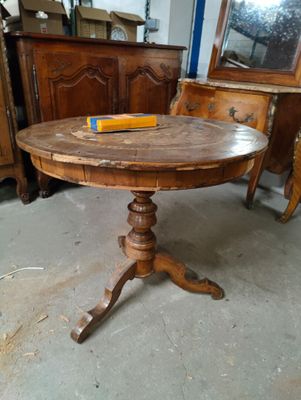 a wooden table with a book on it in a room