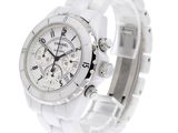 a white watch with a white bracelet on a white background