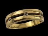 un gros plan d'une bague en or sertie de diamants sur fond noir