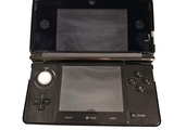 a black nintendo wii game console with a black screen