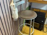 a chair and a table in a small room