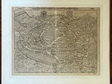 an old map of a town in a wooden frame on a table
