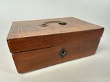 a small wooden box with a handle on it