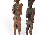 pair of carved wooden figures of a man and a woman