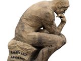 statue of a man sitting on a rock with his hand on his chin