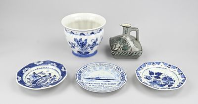 several pieces of blue and white pottery including a teapot, saucer, and plates