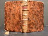 an old book that is sitting on a table