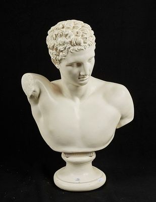 marble bust of a man with curly hair on a pedestal