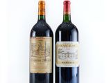 two bottles of wine that are sitting next to each other