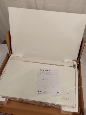 a box with a laptop inside of it on a table