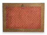 an old red and brown rug with a cross on it