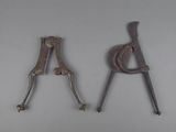 pair of old tools sitting on top of a table next to each other