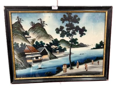 framed picture of a painting of a village by the water