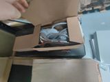 a person opening a box with a laptop inside of it