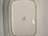 a white plate that has a red line on it