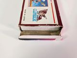 a small box of nintendo games on a white surface