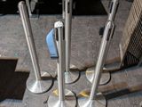 four metal poles that are sitting on the floor