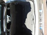 a car with its trunk open in a parking lot