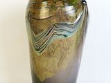 a vase that is sitting on a white surface