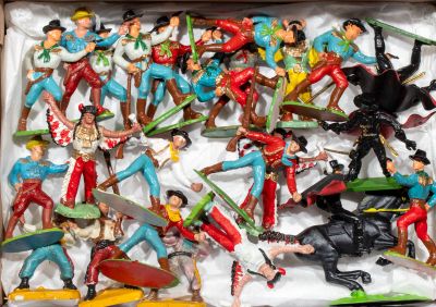 a box full of toy figurines of different types