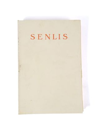 a white book with a red writing on it