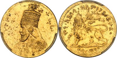 a close up of a gold coin with an image of a man on it
