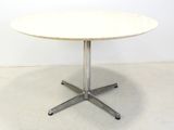 an image of a white table with a metal base
