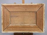 an old wooden easel with a painting on top of it